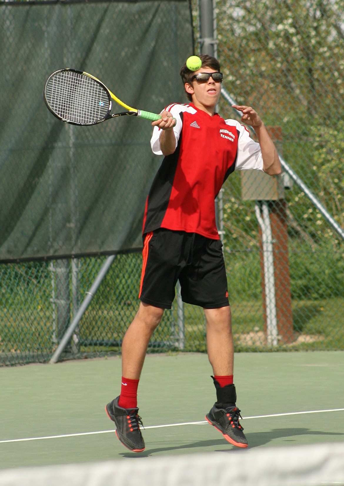 &#151;Photo by ERIC PLUMMER
Matthew Curtiss cracks a forehand, teaming with Patrick Rockwell to win at No. 1 boys doubles in arguably the match of day on Tuesday at Travers Park.