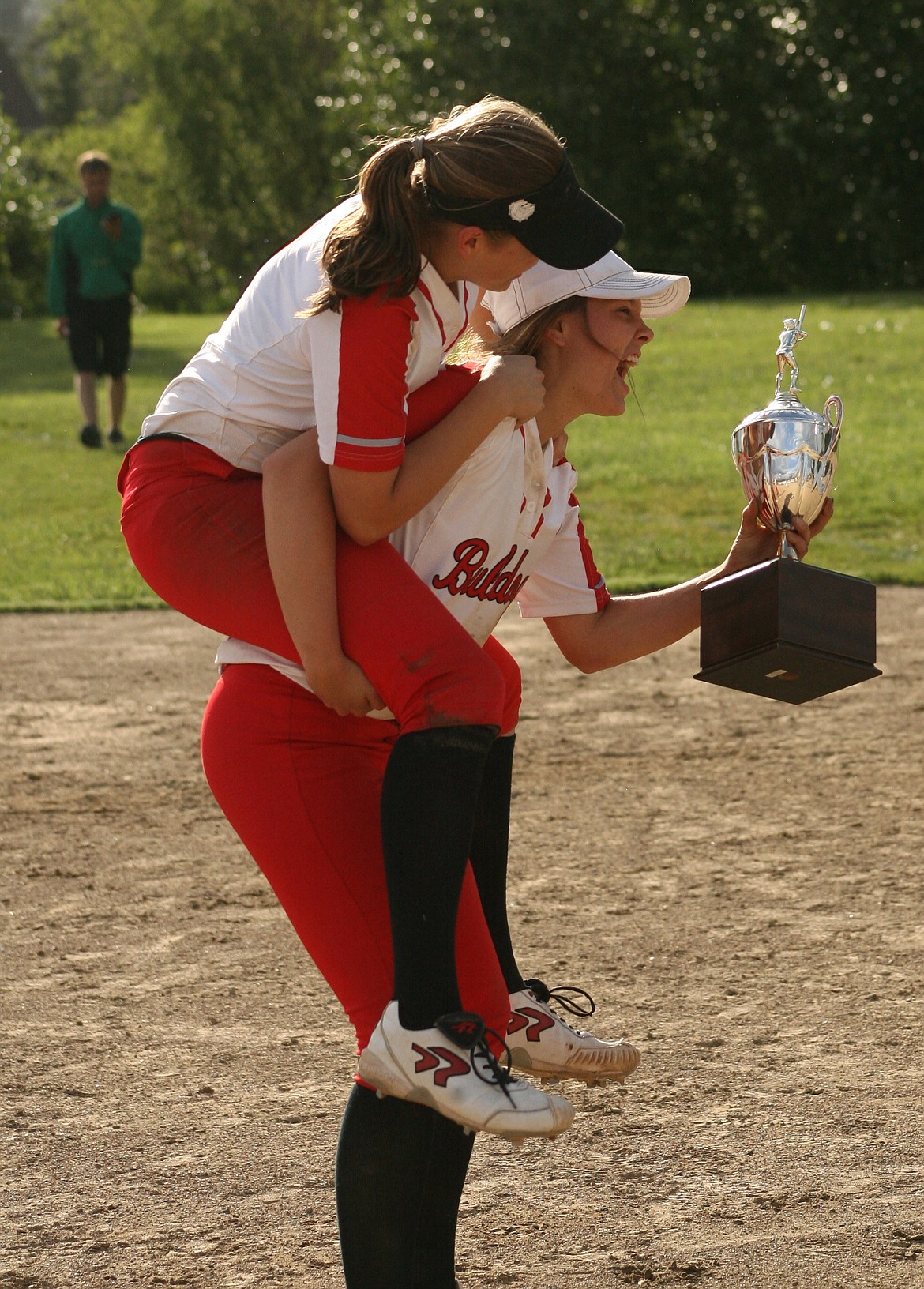 &#151;Photo by ERIC PLUMMER
The Baldree sister, senior Cody, right, and sophomore Bri, have been instrumental in getting the Bulldogs to state. Having an ace pitcher, like Bri, is paramount at state, where every offense can hit.