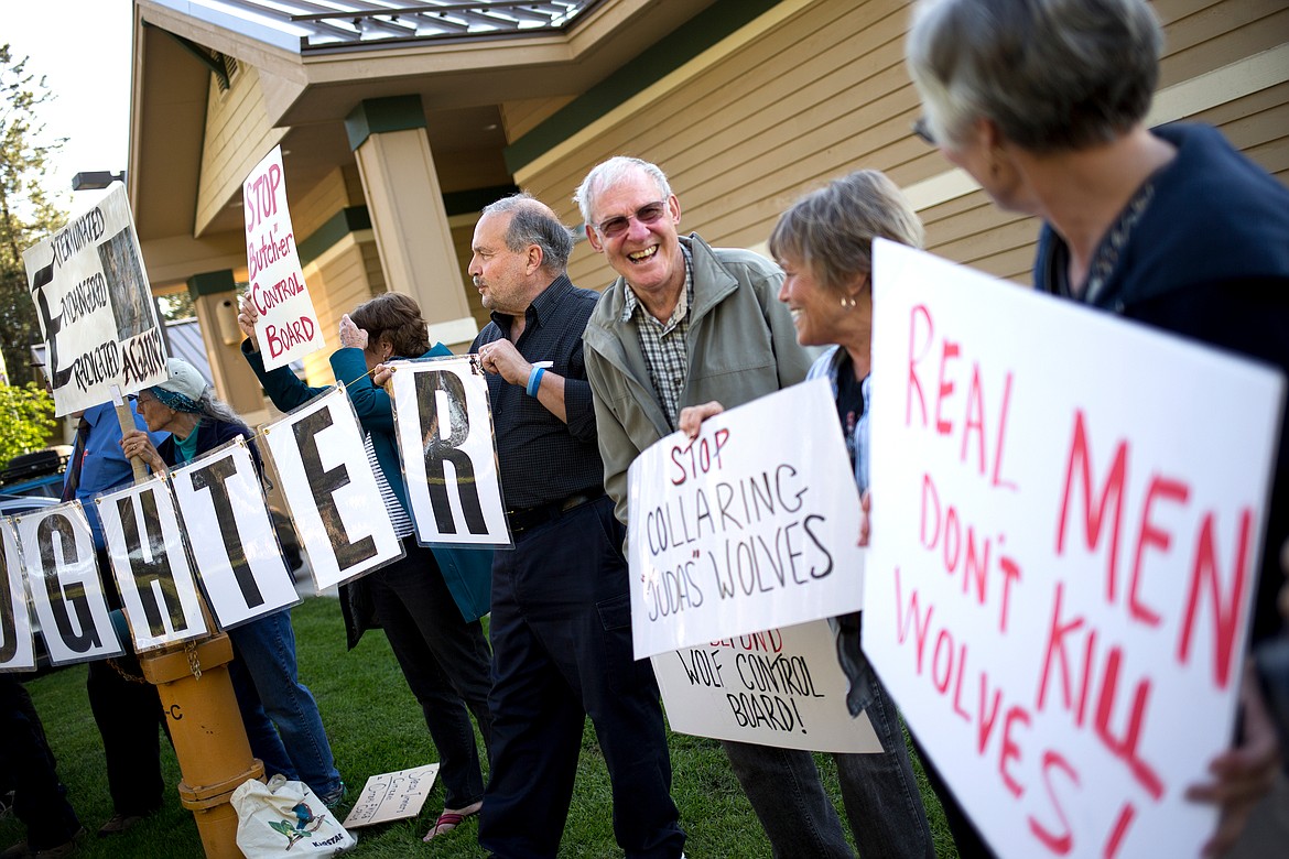 JAKE PARRISH/Hagadone News Network
Juergen Nolthenius of Coeur d&#146;Alene laughs as he and more than 20 others protest on Monday the bounty killing of wolves in Idaho.