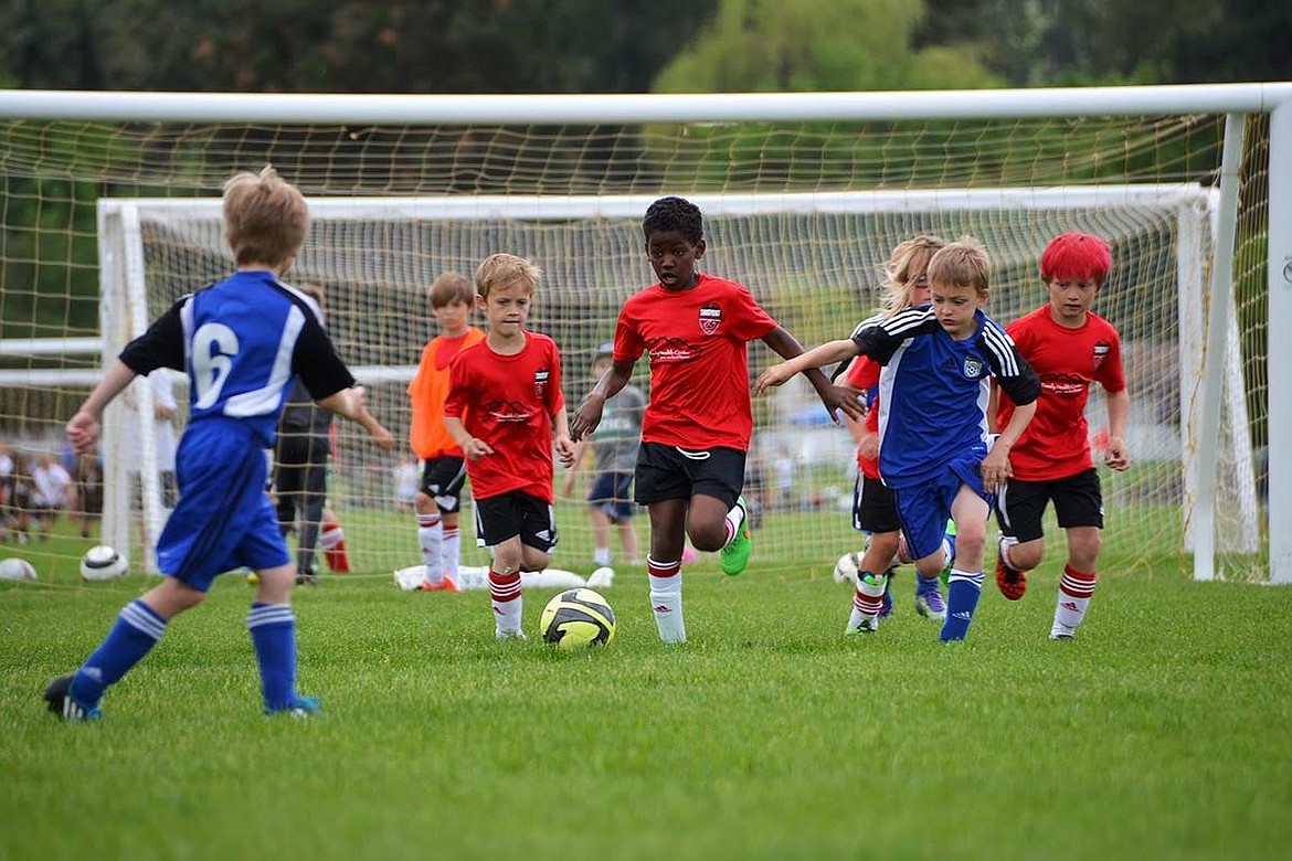 ABOVE: The Strikers U9 team, pictured above at Hot Shot, has been competing this spring, the youngest of all the club teams. The U8 Dragons of the SSA, not pictured, have also been in action in the Rec League, picking up their first win recently. According to the coach, the kids showed heart and scored several goals as a result of teamwork and passing skills. The Dragons roster: Aaron Betz, Cruz Lomeli, Lucas Garrison, Ethan Johnson, Devon Nowlin, Ramsey Sherman, Jonathan Gaulrapp, Joshua Beuskens and Oliver Shipton.

RIGHT: Harmonee, who plays for the U10 Rec League Aliens team, is part of a Southside team that was looking for a coach early in the season. As sometimes happens in SSA Rec League, a parent with no soccer background is asked to step in and coach. Luckily for the Aliens, Harmonee&#146;s parents stepped up to coach and are having a great time as they learn the game with the kids. &#147;I want to thank the parents, and another soccer coach, aka Lee Vanhorn, for helping Rachel and I get pointed in the right direction,&#148; wrote Ron Chudy. &#147;You gotta love this small town community.&#148;
&#151;Courtesy photos