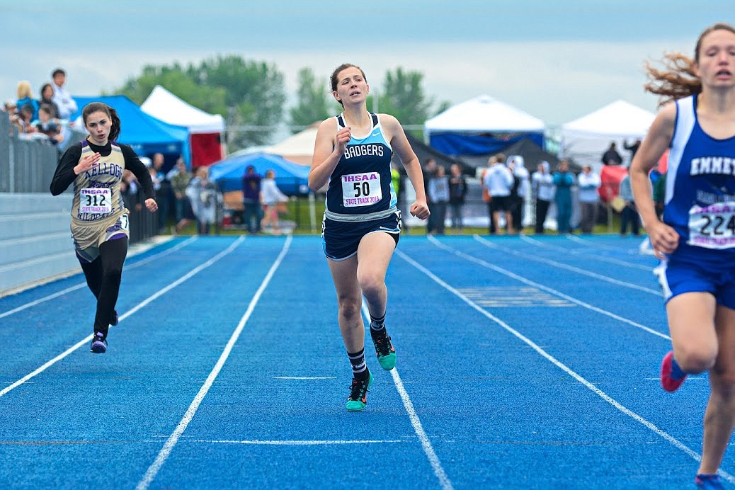 Photo by ROBERT LAVALA
Badger Natasha Webster competes in the 400 meters.