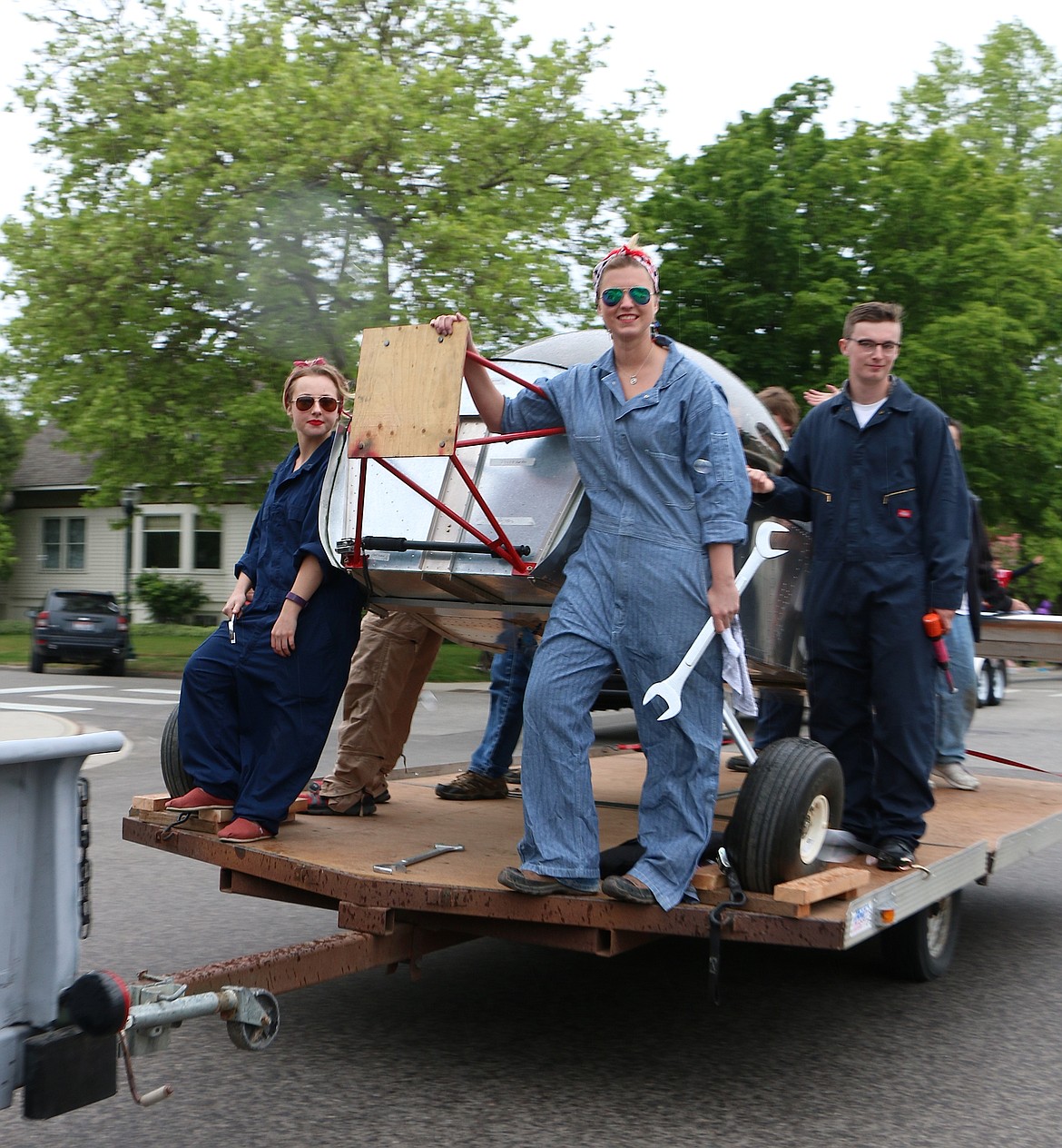 &#151;Photo by CAROLINE LOBSINGER
Sandpoint High School Aerospace Club members ride with a plane they&#146;re working to build during Friday&#146;s Lost in the &#145;50s parade.