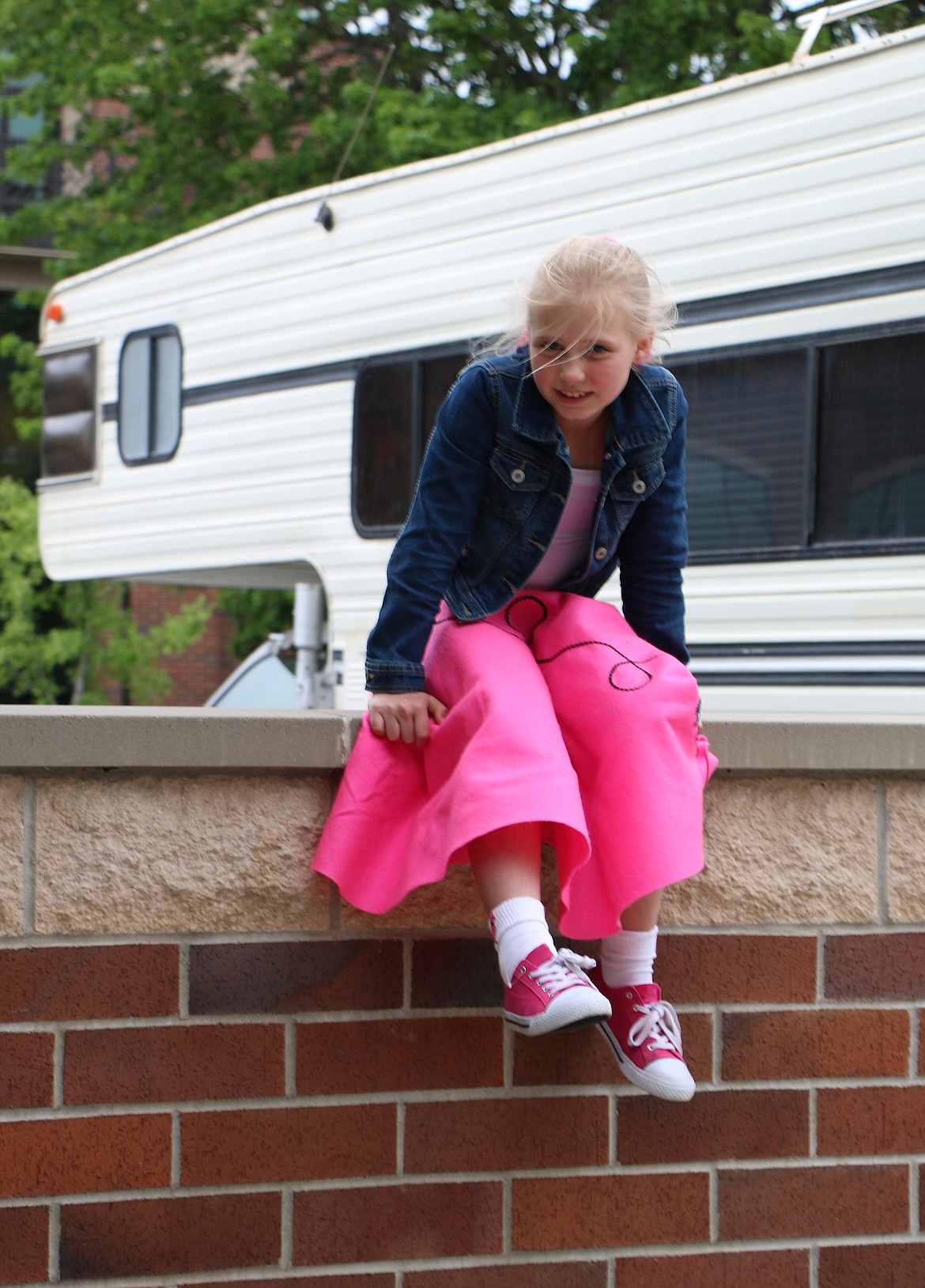 &#151;Photo by CAROLINE LOBSINGER
Madison Peck finds a great place to watch the Lost in the &#145;50s parade on Friday.