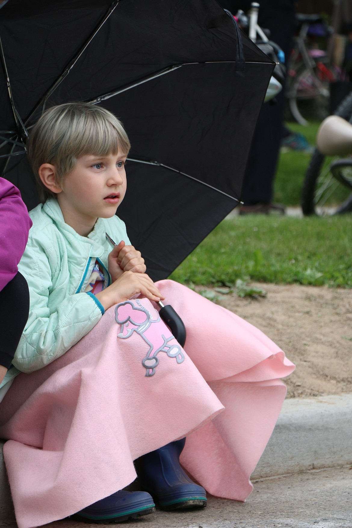 &#151;Photo by CAROLINE LOBSINGER
Beverly Midstokke comes dressed for &#145;50s fun as she waits for the start of Friday&#146;s Lost in the &#145;50s parade.