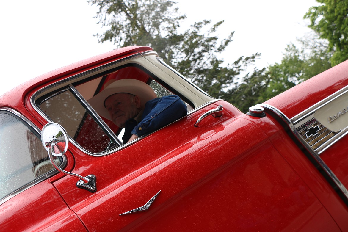 &#151;Photo by CAROLINE LOBSINGER
A classic car owner drives down Church Street during Friday&#146;s Lost in the &#145;50s parade.