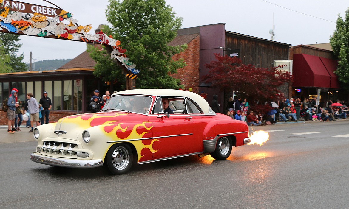 &#151;Photo by CAROLINE LOBSINGER
A classic car driver heads down First Avenue during Friday&#146;s Lost in the &#145;50s parade.