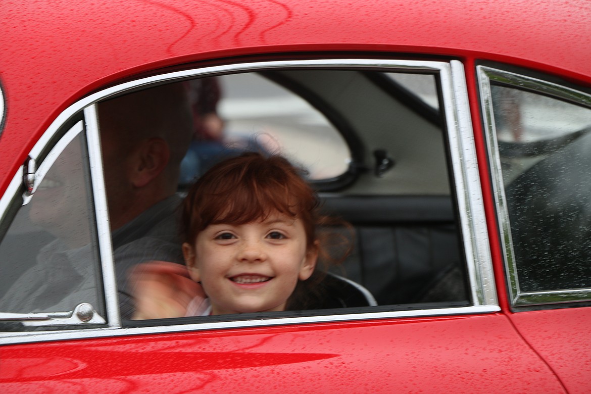 &#151;Photo by CAROLINE LOBSINGER
A youngster smiles from the inside of a classic car during Friday&#146;s Lost in the &#145;50s parade.