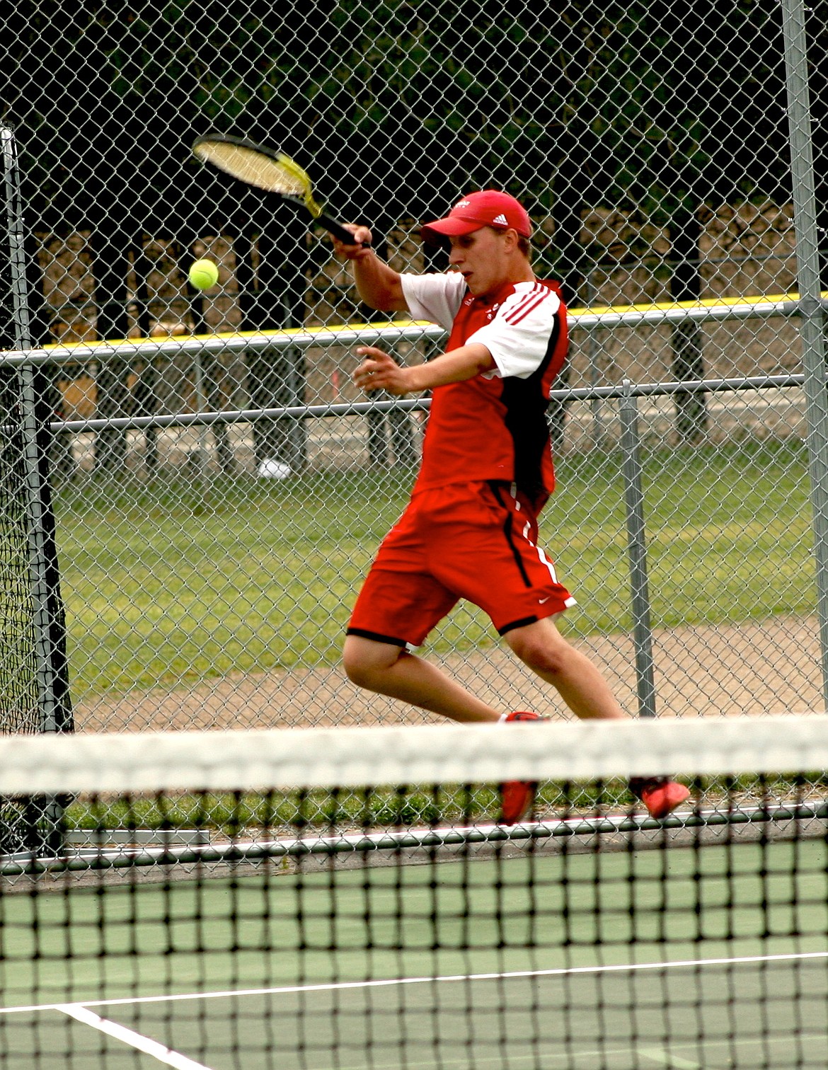 Michael Favor, pictured retrieving a deep ball at districts, will team up with Liz Parsley in hopes of earning a medal in mixed doubles.