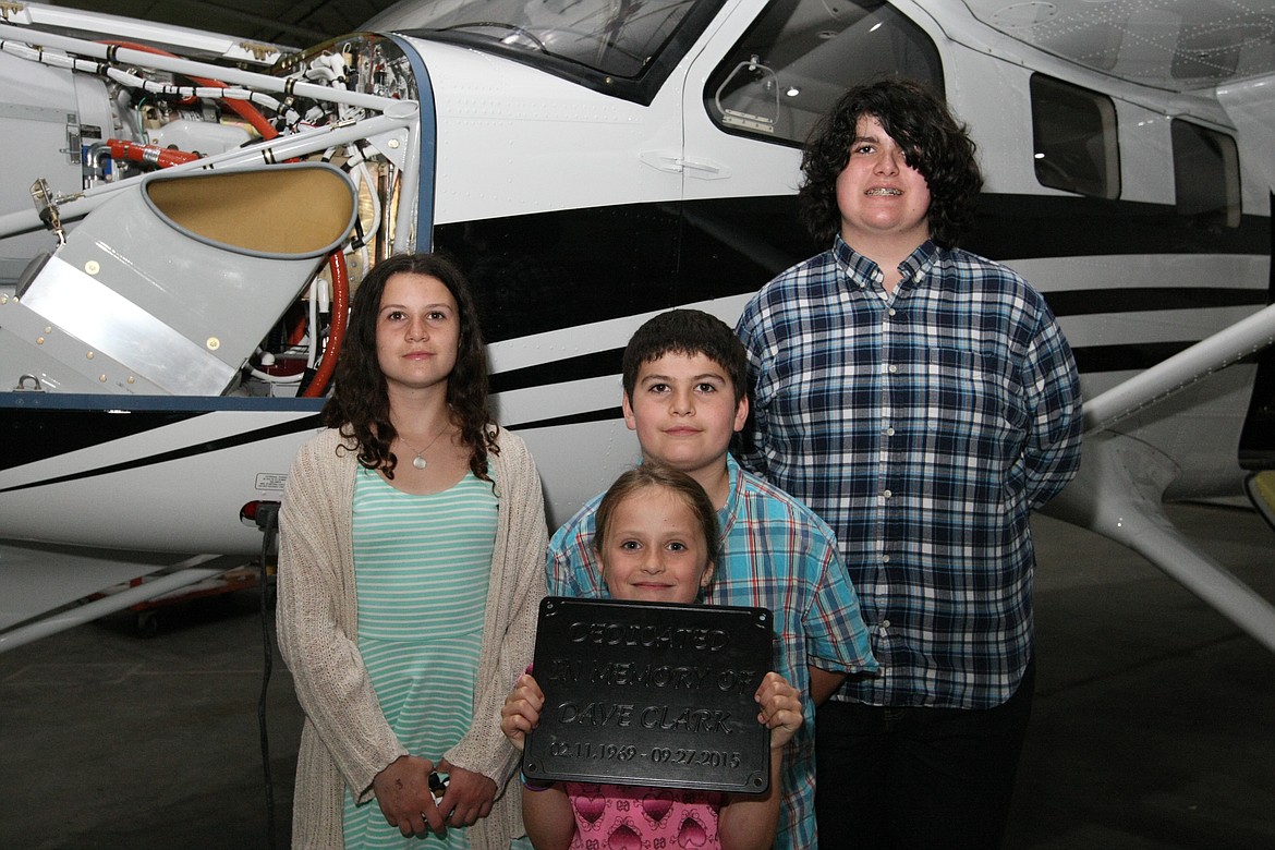 &#151;Photo by JIM McKIERNAN
The Clark children, Ellen, Leah (front) Will and Jack stand in front of a new Kodiak Aircraft in final assembly. Their father, Dave Clark, was instrumental on the expansion plans for Quest Aircraft.