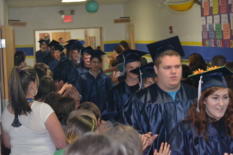 2016 Seniors greeting the 400 student at Valley View in their Cap and Gowns.