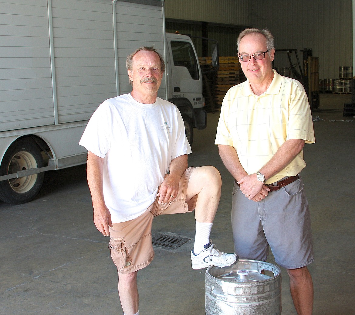 &#151;Photo by DAVID GUNTER
Brothers Kevin Jones and Bill Jones Jr., mark the end of an era after this month&#146;s sale of the longtime Sandpoint family business, primarily to Odom Distributors. The local beer distributor first opened in 1951.