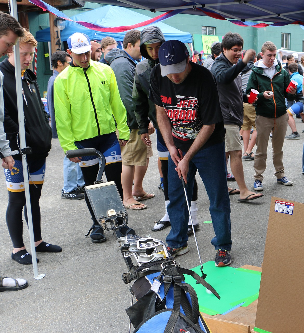 &#151;Photo by LYNNE HALEY

Journey of Hope cyclists join their hosts in practicing some putts at the PSNI carnival Thursday.