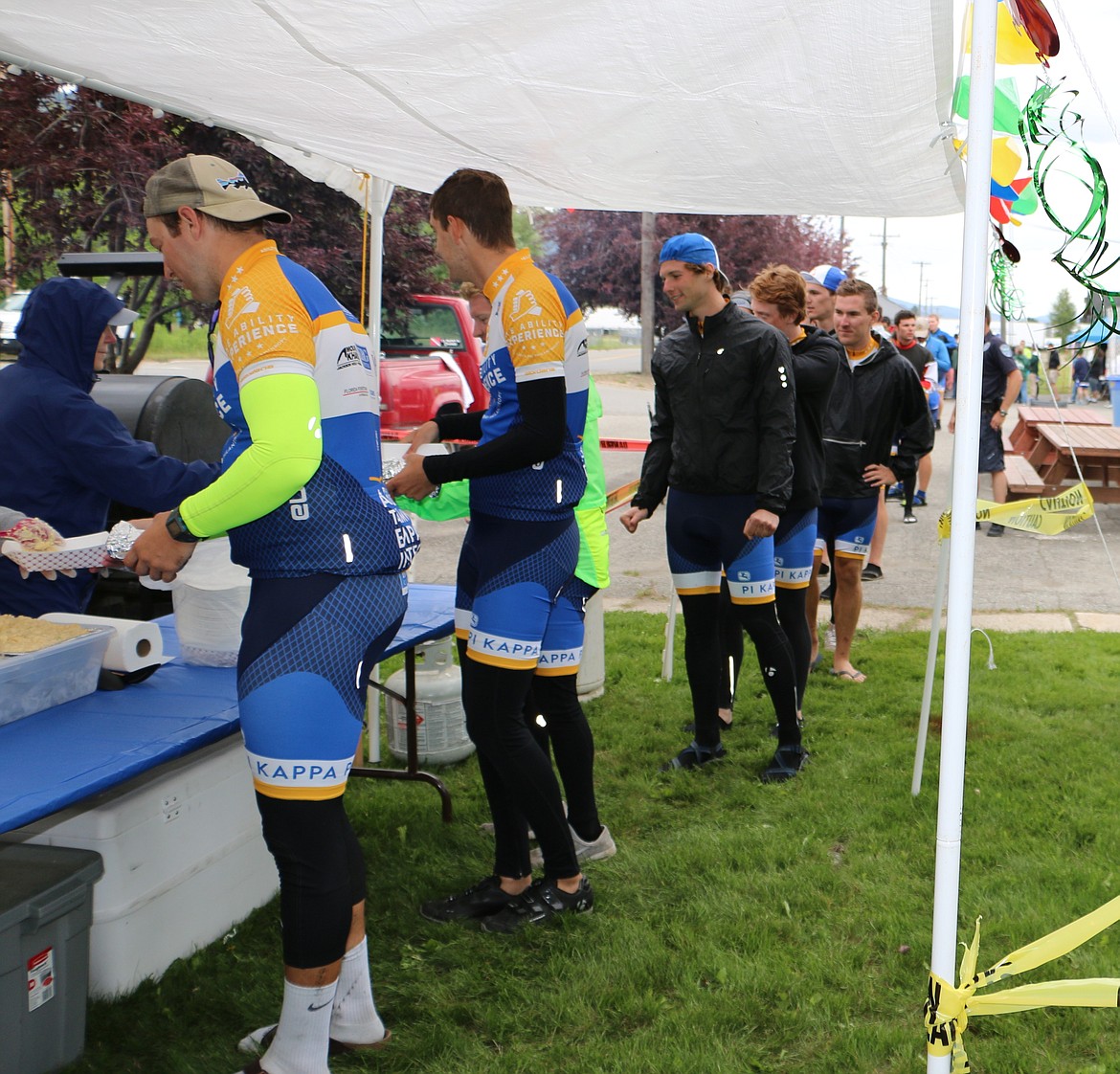 -- Photo by LYNNE HALEY

PSNI volunteers feed hungry Pi Kappa Phi cyclists Thursday as they stop into Sandpoint on their Journey of Hope.