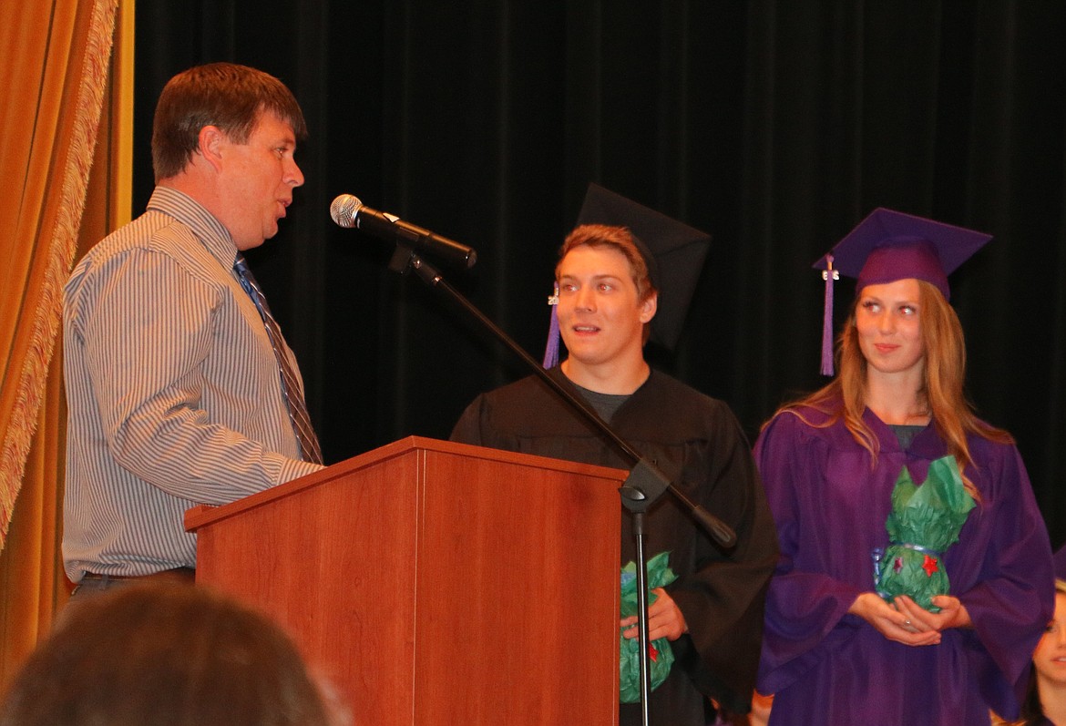 -- Photo by LYNNE HALEY

Luke Childers, graduation coach for LPOHS, presents seniors Jacob Porter and Sterling Healy with commemorative gifts. &quot;You're the reason I do this,&quot; Childers said.