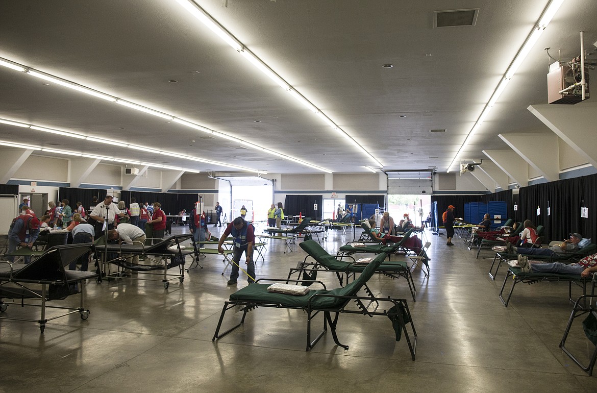 LOREN BENOIT/Press

Emergency personnel set up 50 beds at the Kootenai County Fairgrounds for fictional evacuees.