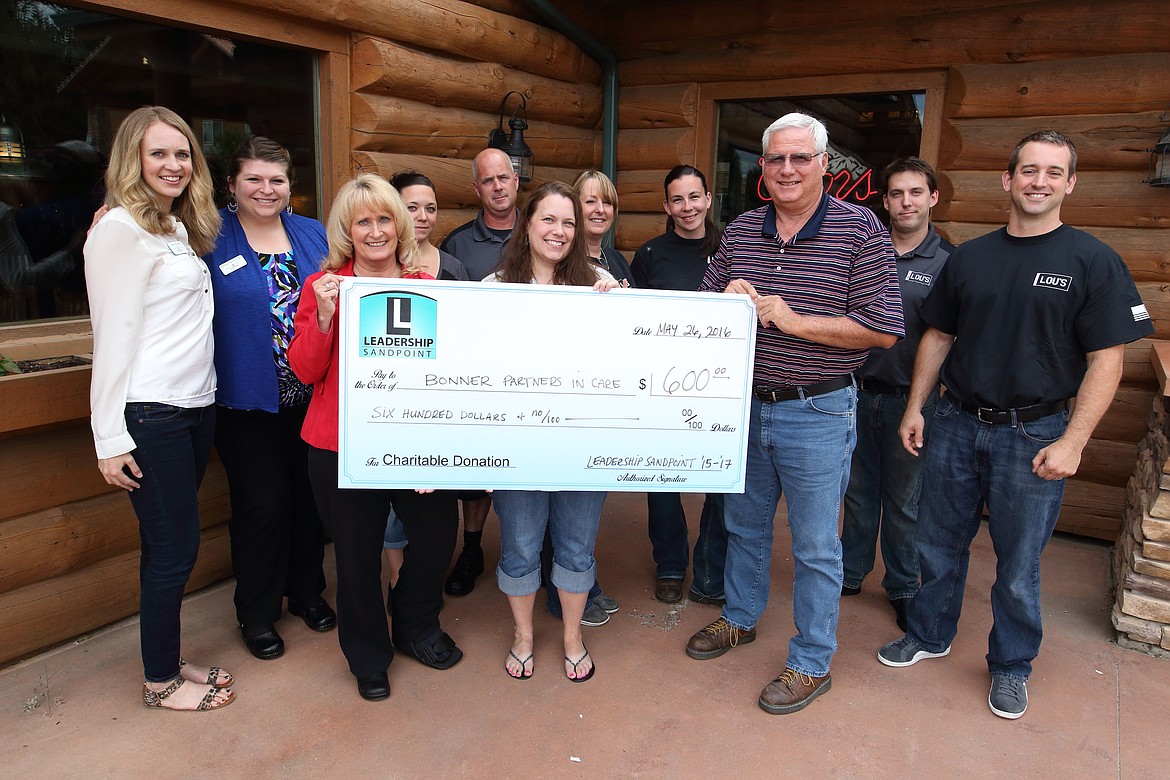 The staff from Bonner Partners in Care, the LeadershipSandpoint team and Sweet Lou&#146;s hold a check for $600.