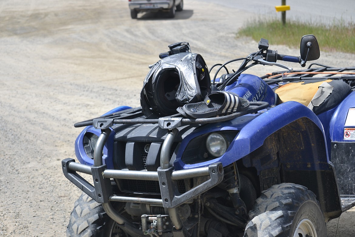 Photo by: SARAH JENKINS
Scene from yesterday&#146;s rollover ATV accident with flip flops as riding gear.
BCSO responded to a rollover OHV accident June 13 involving unlicensed juveniles. With the warm weather upon us, often safety goes by the wayside.
In Idaho, all OHVs are required to be registered and have insurance and a muffler. According to the Idaho parks and recreation site, any OHV that is operated on public lands, roads, or trails of the state of Idaho, must display a current IDPR OHV registration sticker or current sticker from owner&#146;s residence.  Any person that does not have a valid driver&#146;s license, must complete and carry their certificate of OHV education completion course. When riding OHV remember to wear appropriate clothing, shoes (not flip flops) and helmets-mandatory if under 18 years of age in the state of Idaho. If riders are under 16 years of age, adults are required to supervise at all times. When riding on private property, do not forget to obtain permission.
By the water, the temperature outside is hot...but the water is not. Know your limits--use life vests.
Bicycles and skateboards are a great means of transportation for all. When riding on the streets, remember to obey the laws of the streets; parents remind your younger children of the laws.
Have a fun and safe summer.