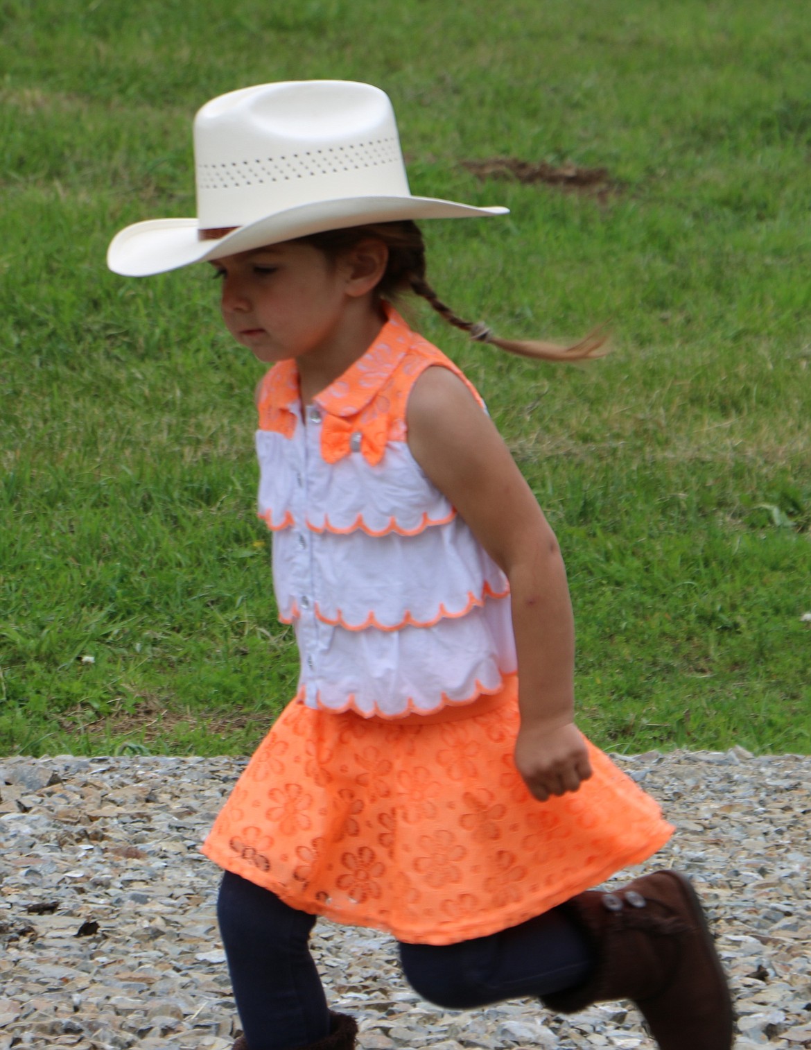 -- Photo by LYNNE HALEY

A budding cowgirl has fun at the A-T Ranch centennial celebration Saturday.