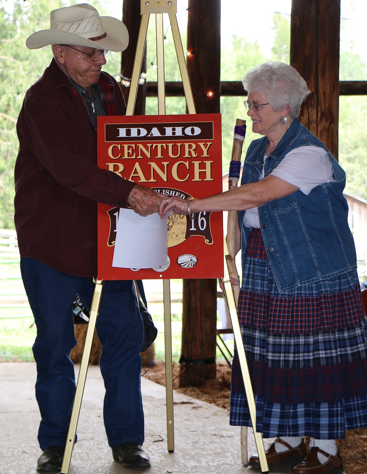 &#151;Photo by LYNNE HALEY
Don and Terri Albertson of A-T Ranch accept a commemorative sign from the Idaho Historical Society to mark the 100th year of their family operation.