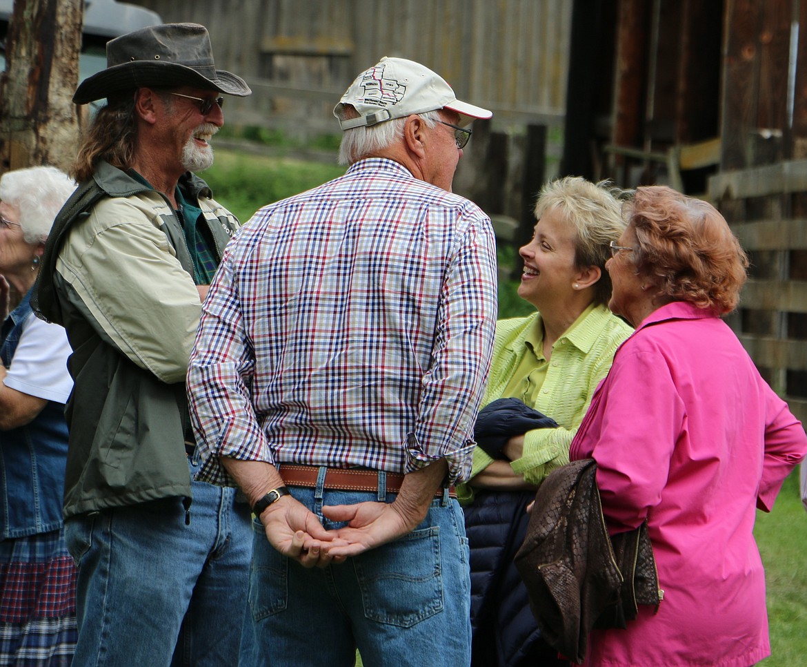 -- Photo by LYNNE HALEY

Friends gather at the Albertson ranch as they celebrate their 100th anniversary. Left to right, Mike Keough, Don Pischner, Shawn Keough and an unidentified friend.