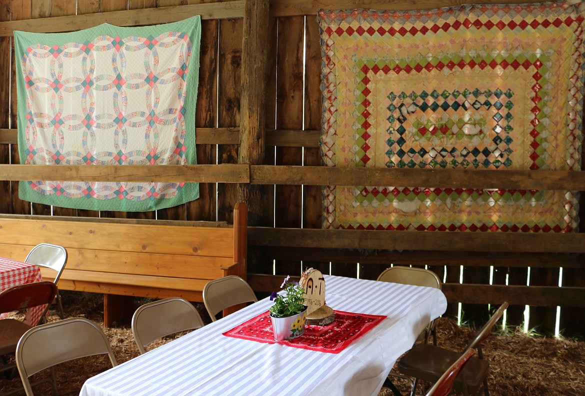 -- Photo by LYNNE HALEY

Beautiful quilts, hand-pieced by matriarch Wilma Albertson for members of her family, graced the site of the celebration on Saturday.