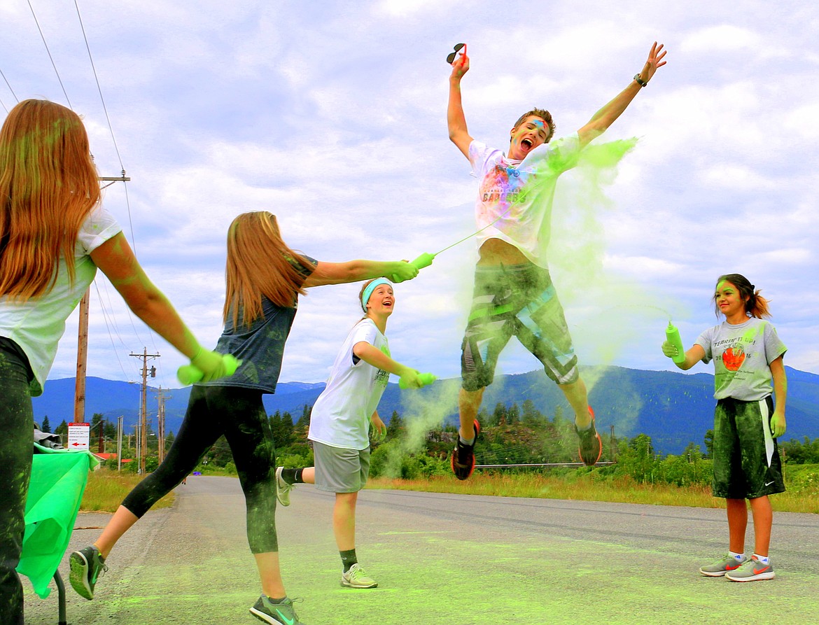 Photo by HANNAH SUCSY WILLIS
Participant runs through the green station sponsored by the Oxford Inc. at Saturday&#146;s Color Run. Look for more pictures and info in next week&#146;s edition.