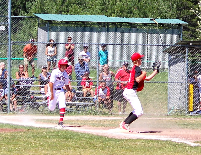 Ethan Butler catches the ball at first, and promptly fired across the diamond to third, as the base runner took off as soon as Cox threw the ball. The team had turned the more conventional 6-4-3 double play earlier in the game to also end an inning, but this one was slightly more special.
&#151;Photo by ANNA BUTLER