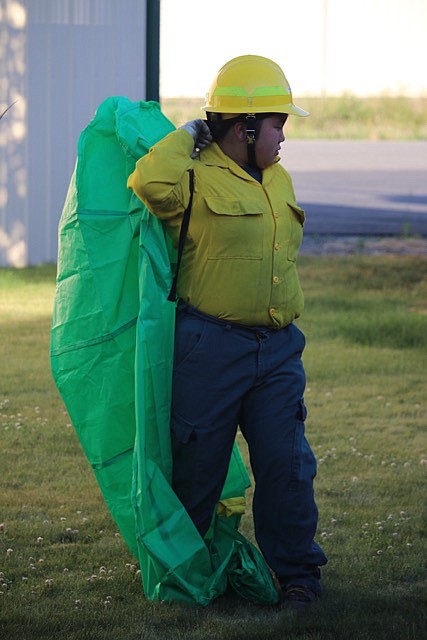 -Photo by JUDD WILSON
Janna Berard practices deploying a fire shelter June 28 at the West Pend Oreille Fire District.