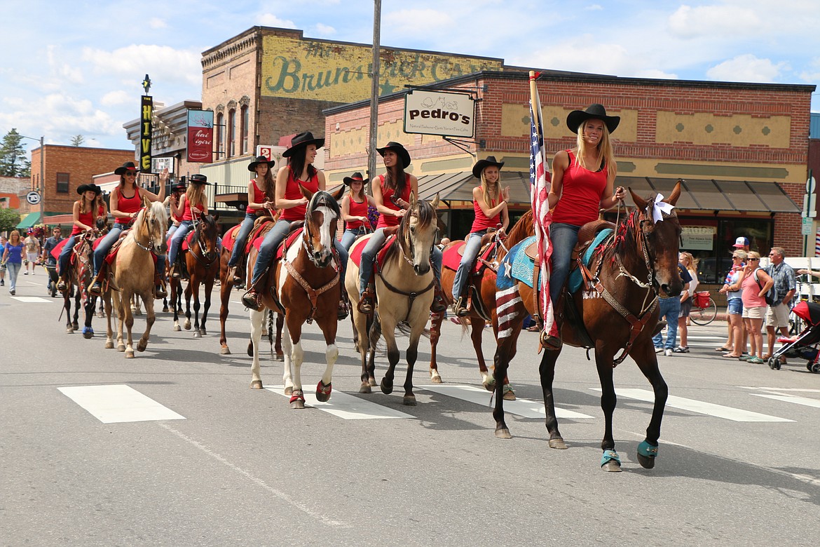 &#151;Photo by CAROLINE LOBSINGER
A group of riders take part in the Sandpoint Lions' Grand Parade on the Fourth of July Monday.