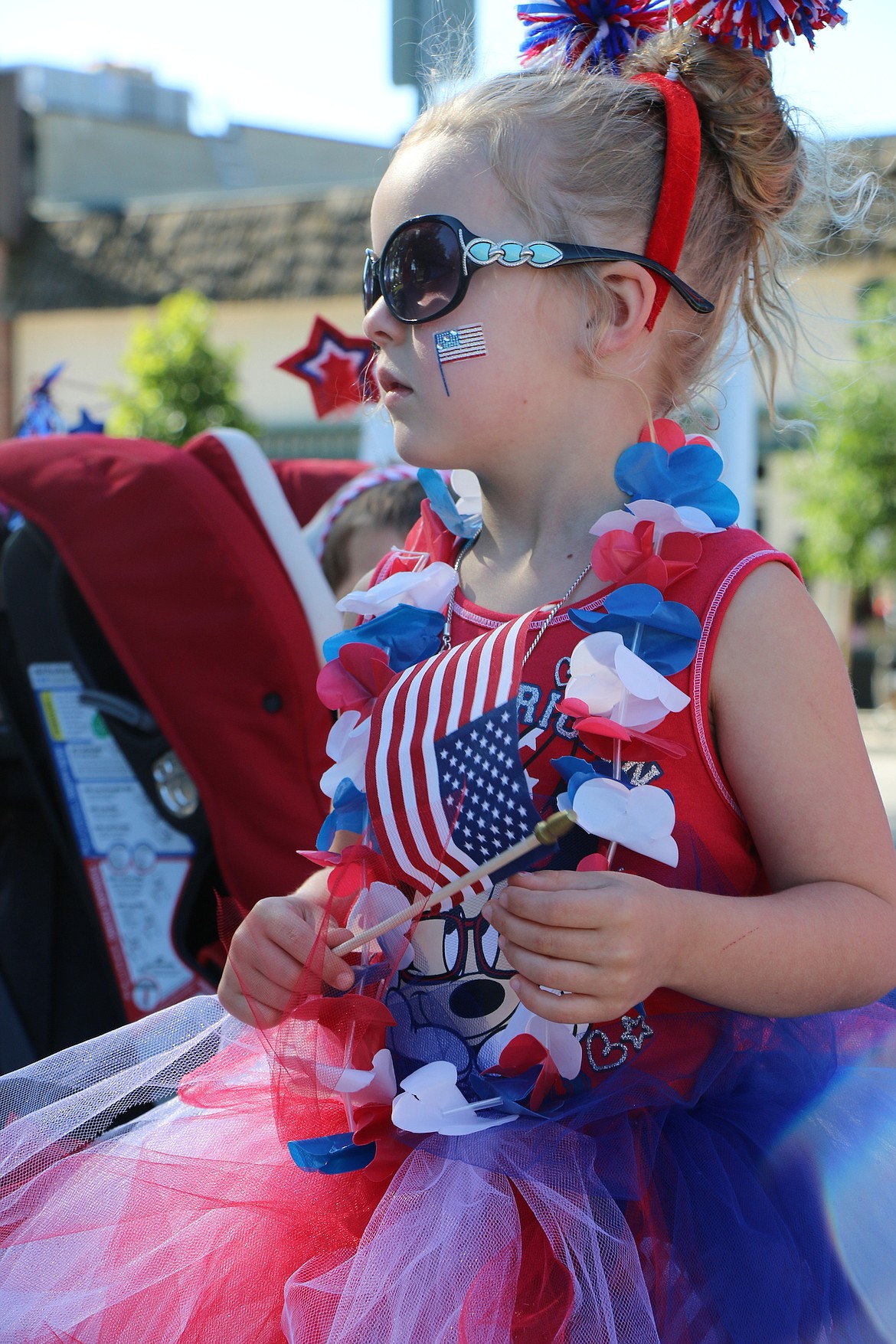 &#151;Photo by CAROLINE LOBSINGER
Annalise Anderson watches as other youngsters arrived for the Sandpoint Lion&#146;s Kids Parade in downtown Sandpoint on Monday.