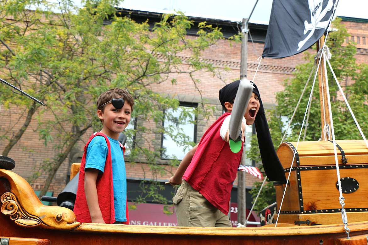 &#151;Photo by CAROLINE LOBSINGER
A pair of pirates get into the spirit of their characters as they ride aborad Capt. Dan Mimmack's pirate boat. The boat was one of about 100 entries taking part in the Sandpoint Lions' Grand Parade on the Fourth of July Monday.