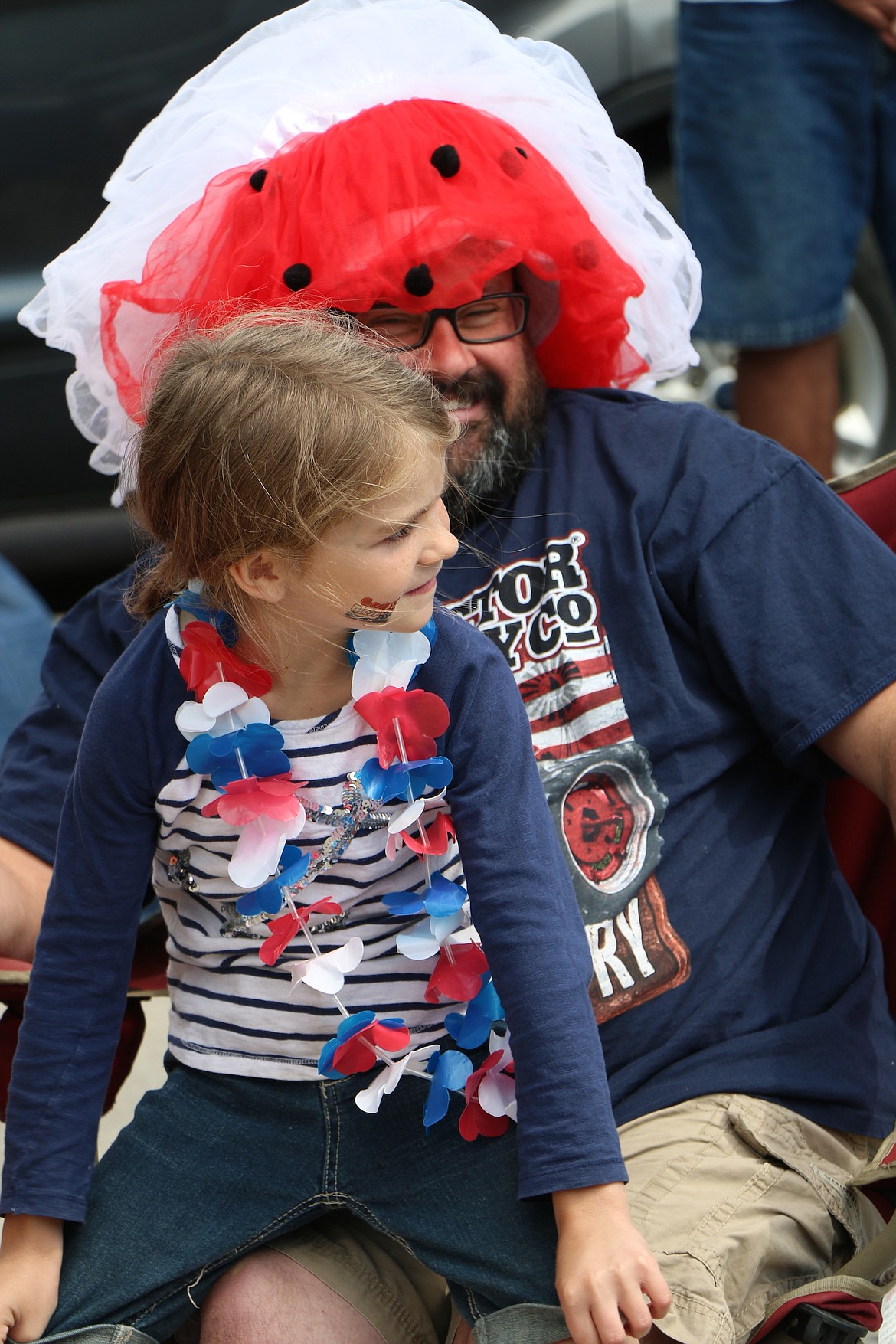 &#151;Photo by CAROLINE LOBSINGER
A pair get into the spirit of the Fourth of July as they attend the Sandpoint Lions' Grand Parade on Monday.