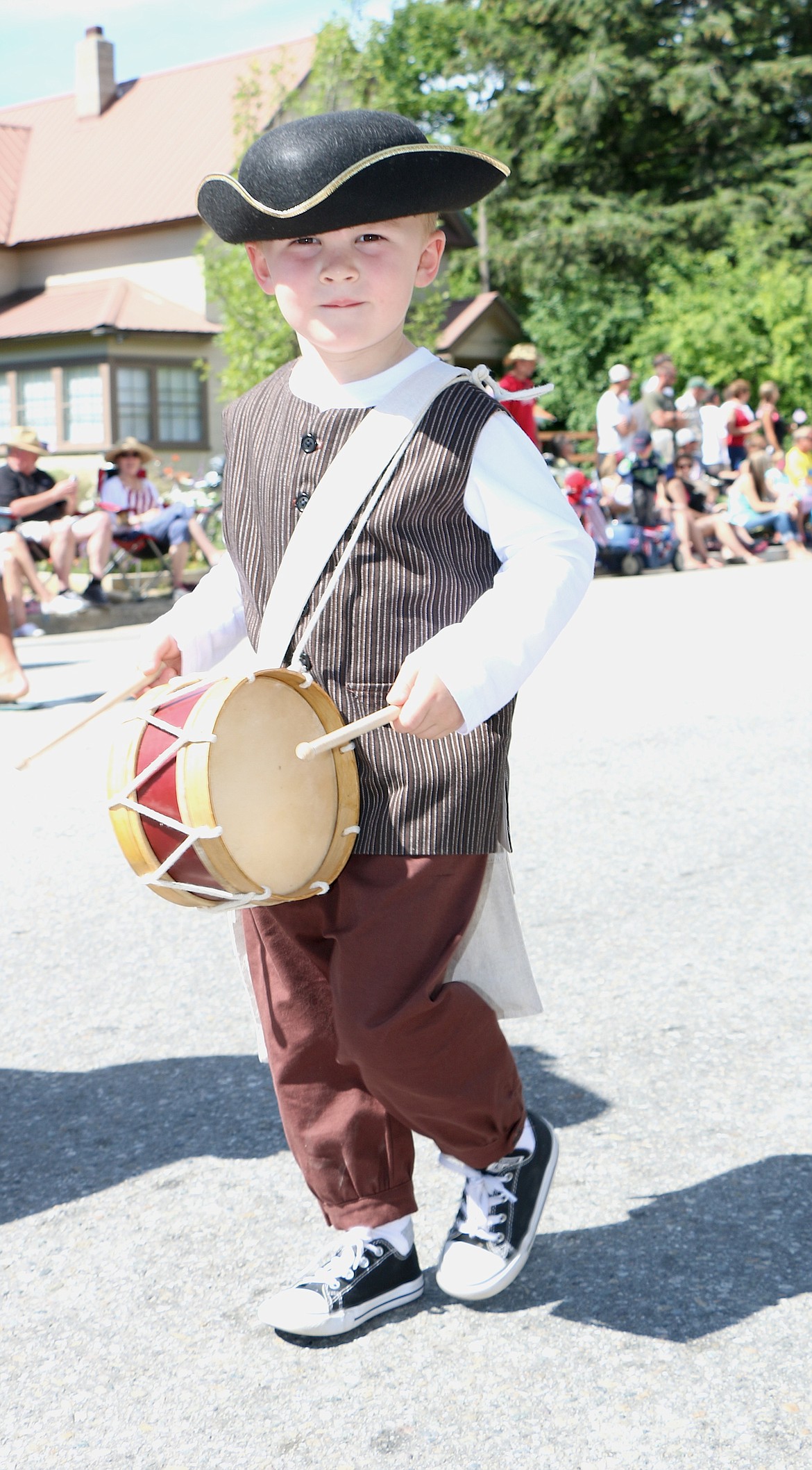 &#151;Photo by CAROLINE LOBSINGER
A young dummer boy marches with the Daughters of the American Revolution group during Monday&#146;s Fourth of July Grand Parade.