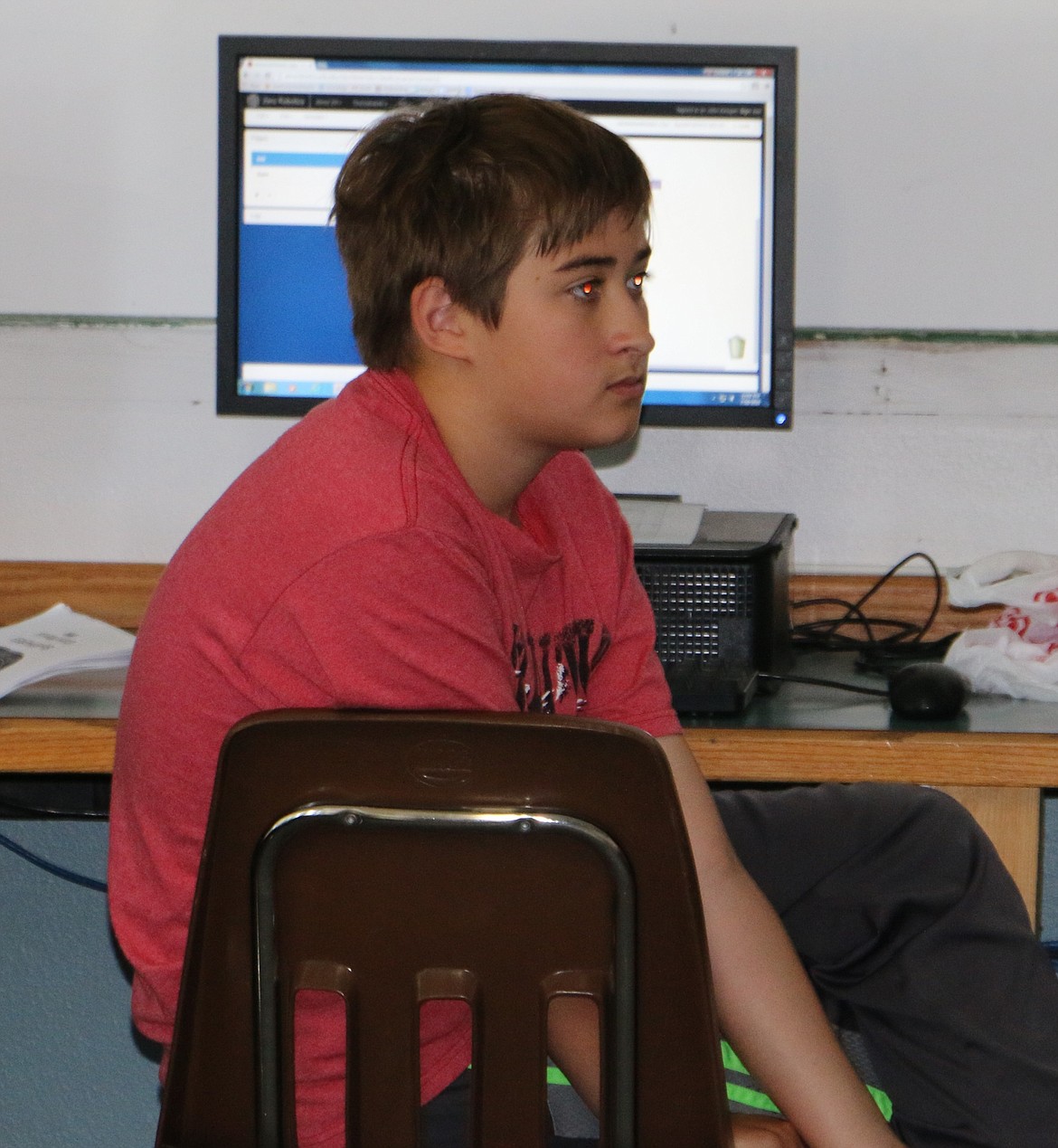 -- Photo by LYNNE HALEY

Middle school student John Keegan listens to instructions during a Zero Robotics class.