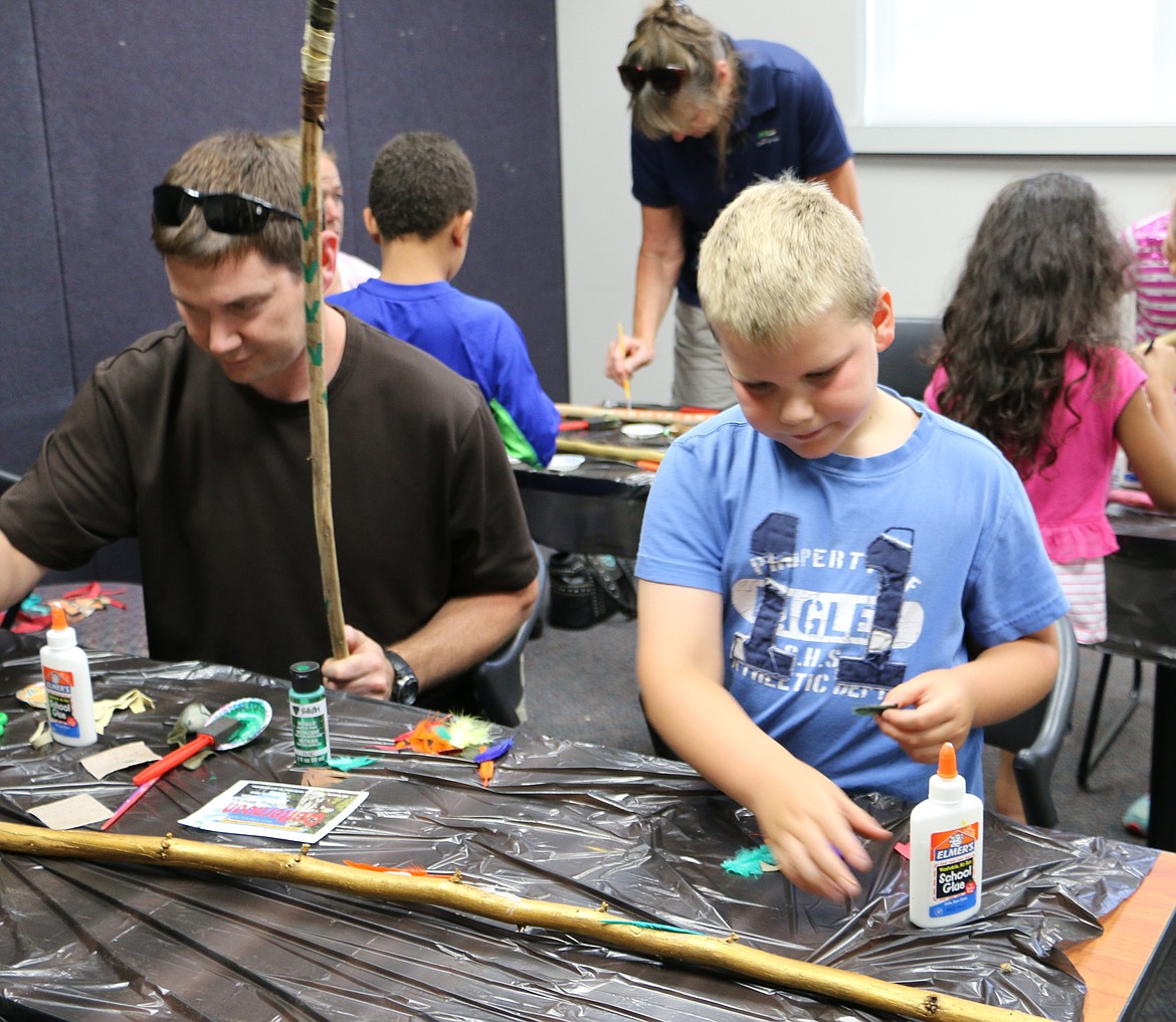 &#151;Photo by LYNNE HALEY
Jeff and Sam Domansky, left to right, get crafty at the EBCLD Sandpoint makers&#146; workshop.