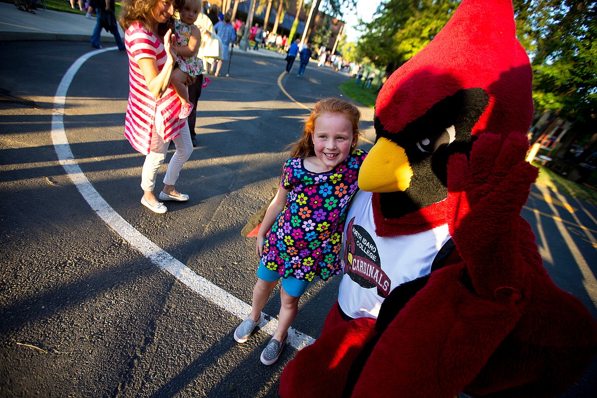 JAKE PARRISH/Hagadone News Network
Chloe Todd, 8, of Coeur d&#146;Alene, gets a hug from North Idaho College mascot Cecil the Cardinal following the college&#146;s Really BIG Raffle drawing on Wednesday.