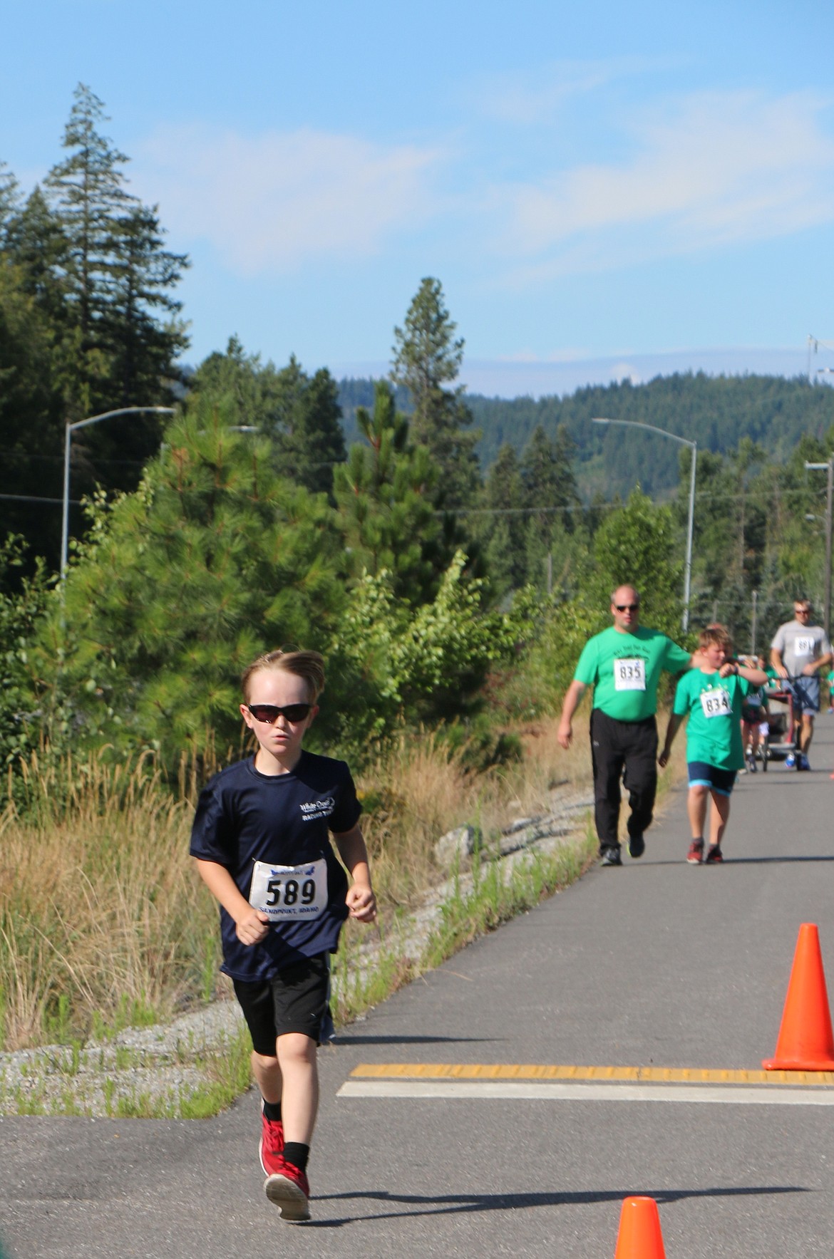 &#151;Photo by CAROLINE LOBSINGER
Mason Howard, 9, runs in Jacey's Race on Sunday.