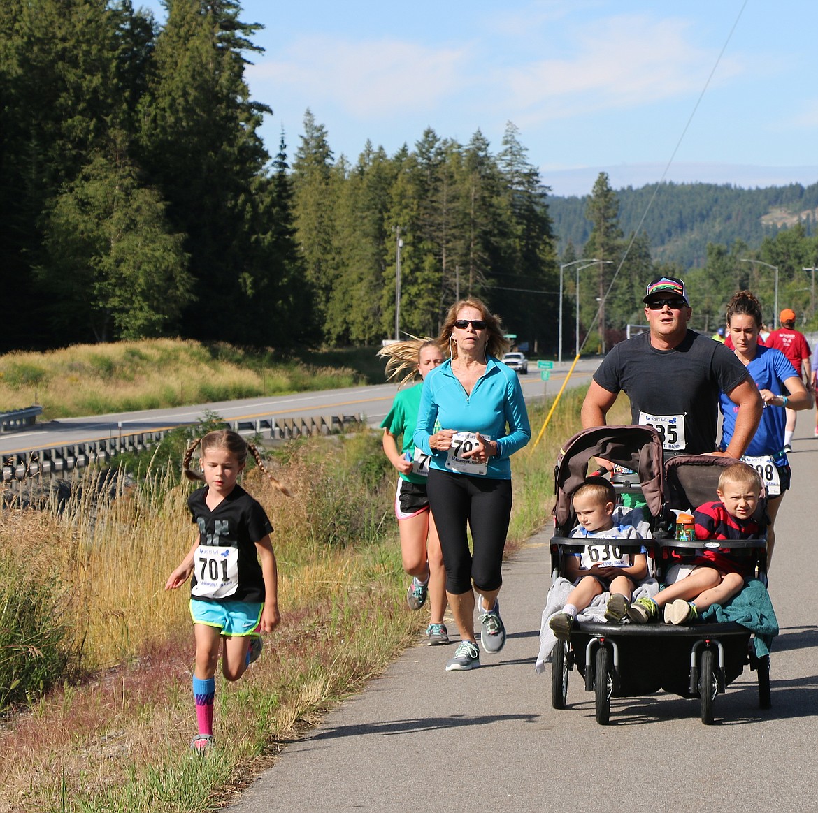 &#151;Photo by CAROLINE LOBSINGER
A family takes part in Jacey's Race on Sunday.