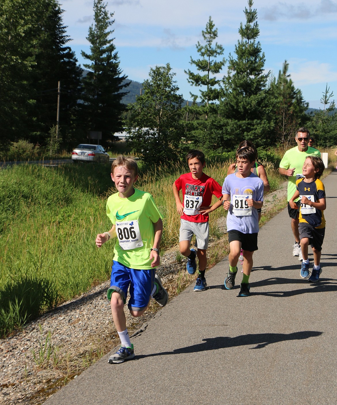 &#151;Photo by CAROLINE LOBSINGER
Zach Zewiesler races along the trail just ahead of Klein Fragoso and Henry Barnes as the trio take part in Jacey&#146;s Race on Sunday.