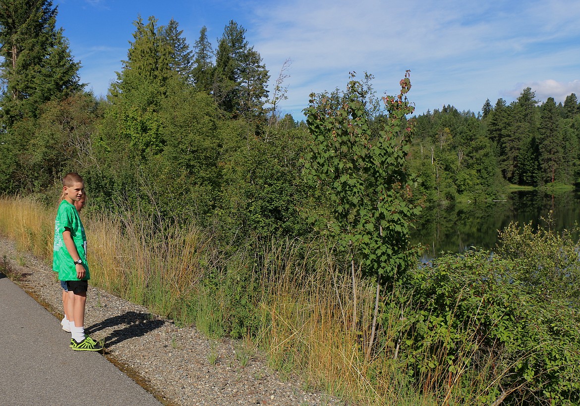 &#151;Photo by CAROLINE LOBSINGER
A pair of youngster pauses to take in the scenery during Jacey's Race on Sunday.