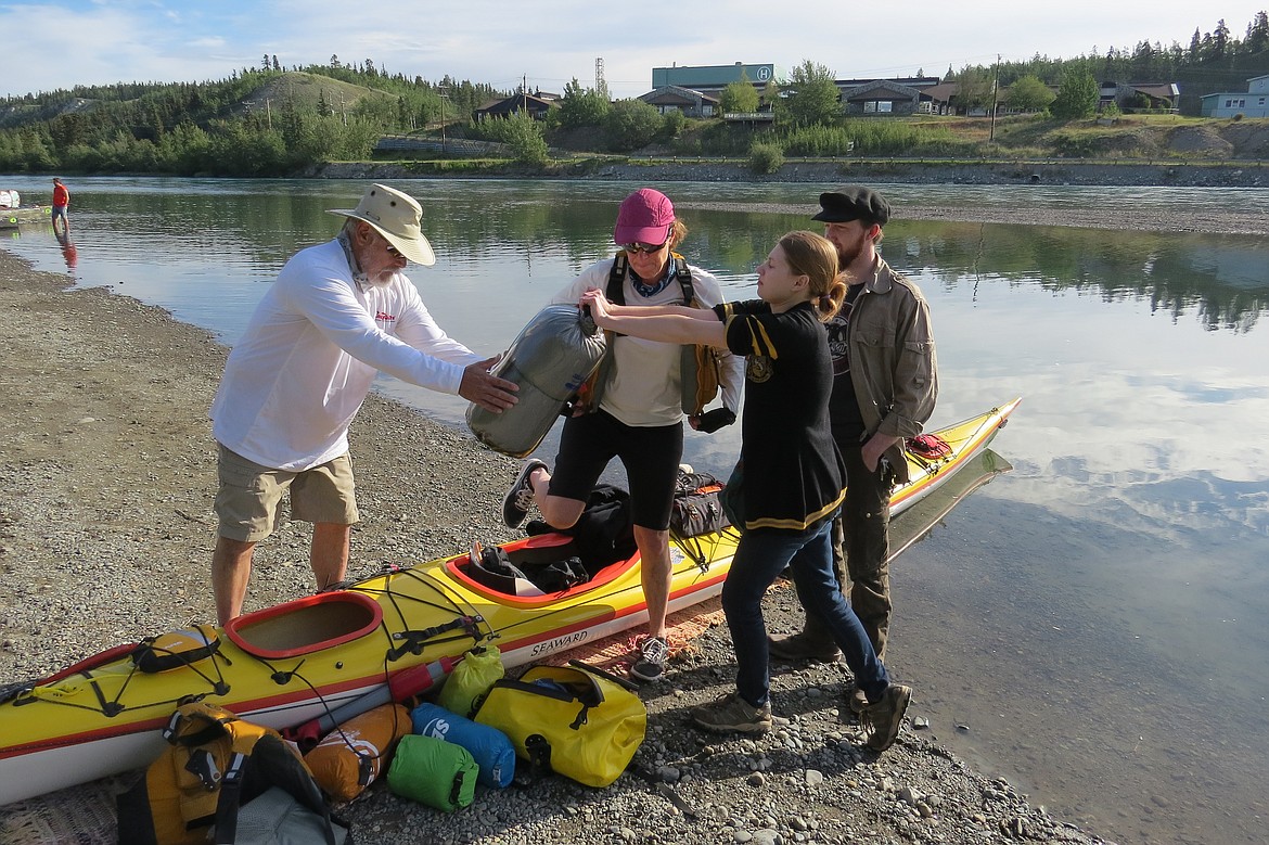 Courtesy photo
Maeve and Ian Kirk assist Josh Friedman and Julie Kirk at the 2016 Yukon River Quest. The Spirit of America team finished 1st in Mixed Tandem Kayak.