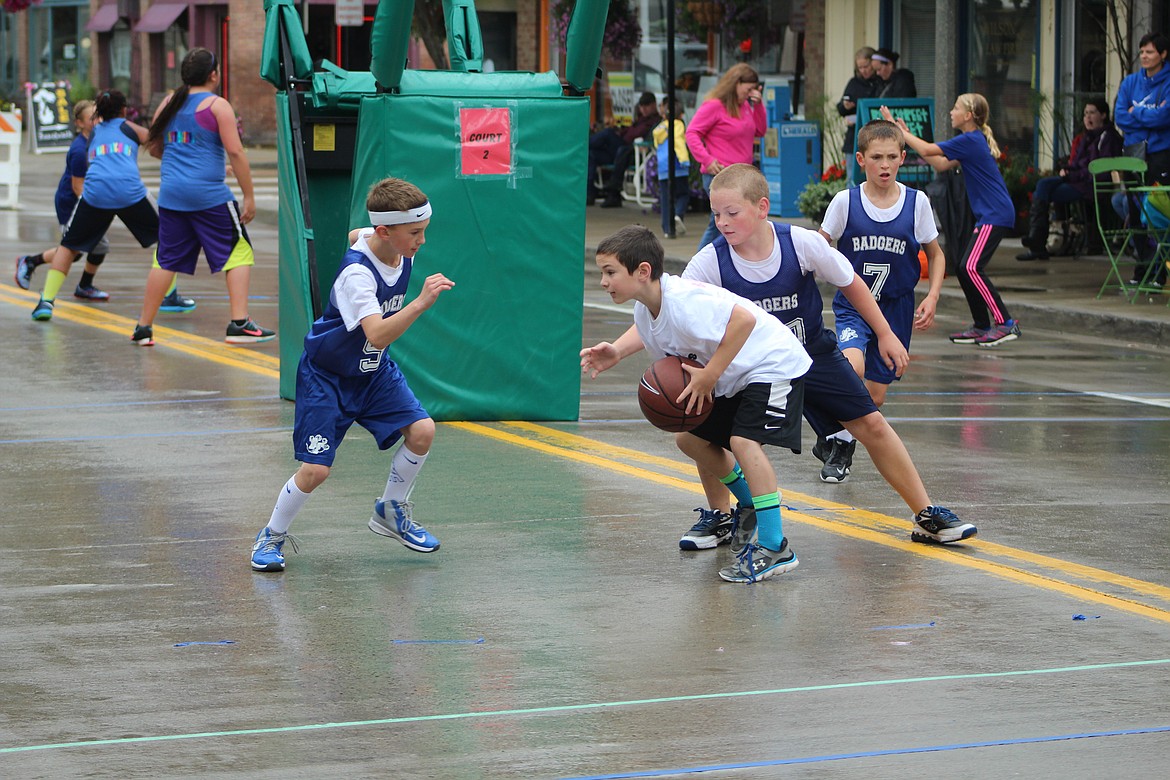 Photo by DON COGGER
A young team shows off their skills in the 2016 SWISH! 3-on-3 Tournament Saturday in downtown Bonners Ferry.