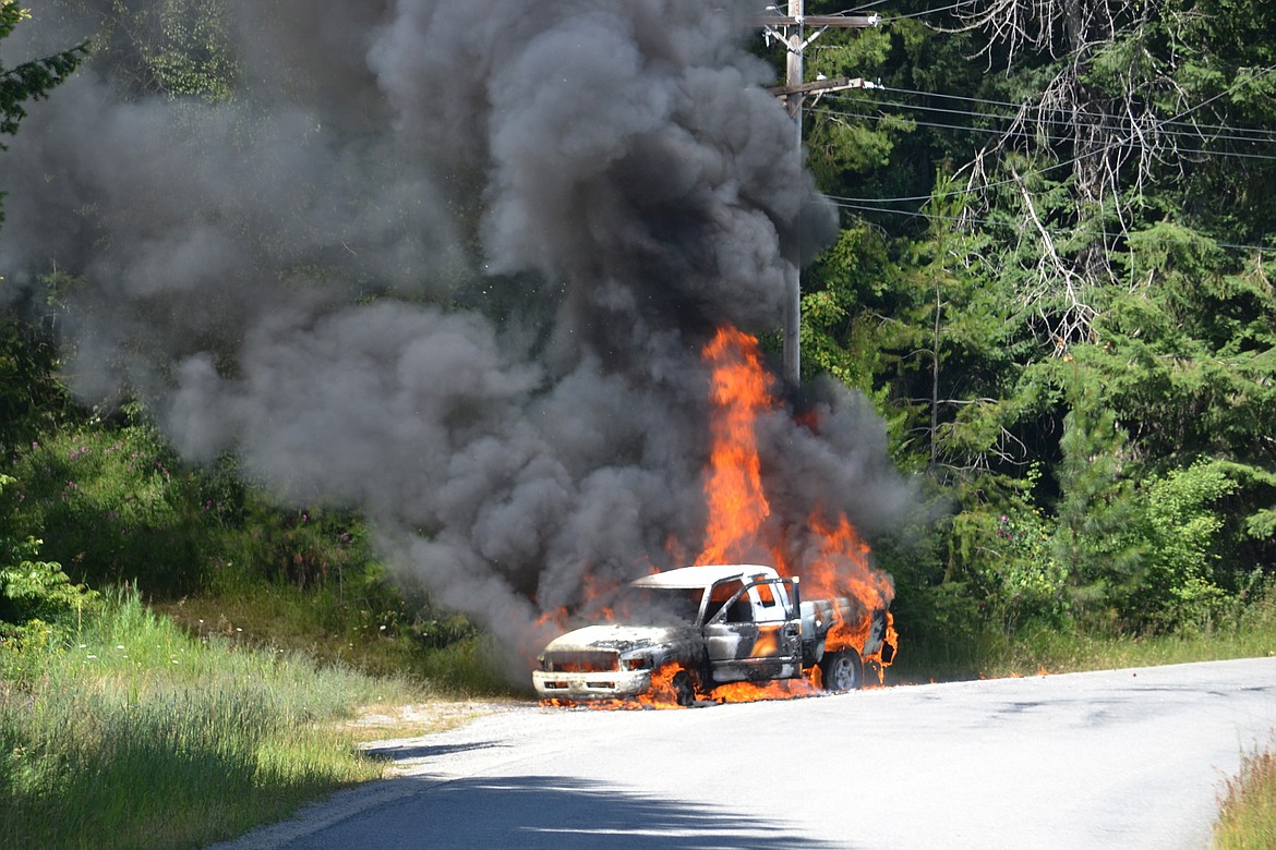 Photo by SARAH JENKINS
South Boundary fire responded to a truck fully engulfed in flames Tuesday at Deep Creek Loop. Flames captured as the explosions were heard from the Dodge truck.