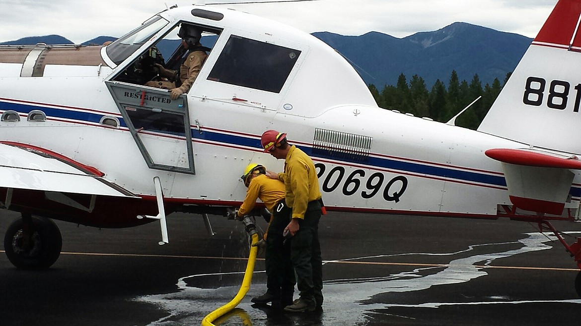 Photo by MARK ELIOT
Teams practice filling up the SEAT for the upcoming fire season.