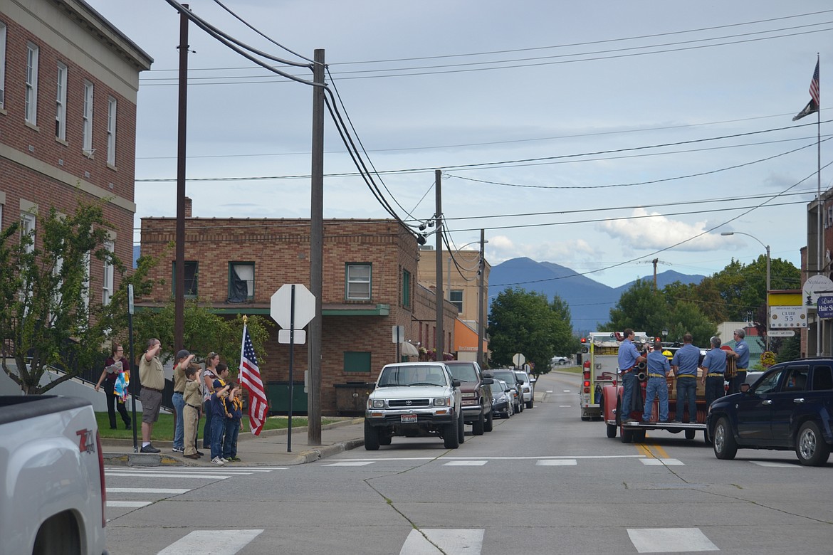 &#151;Photo by SARAH JENKINS
Cub Scout troop of Bonners Ferry pay final respects to firefighter John Glen Savage.