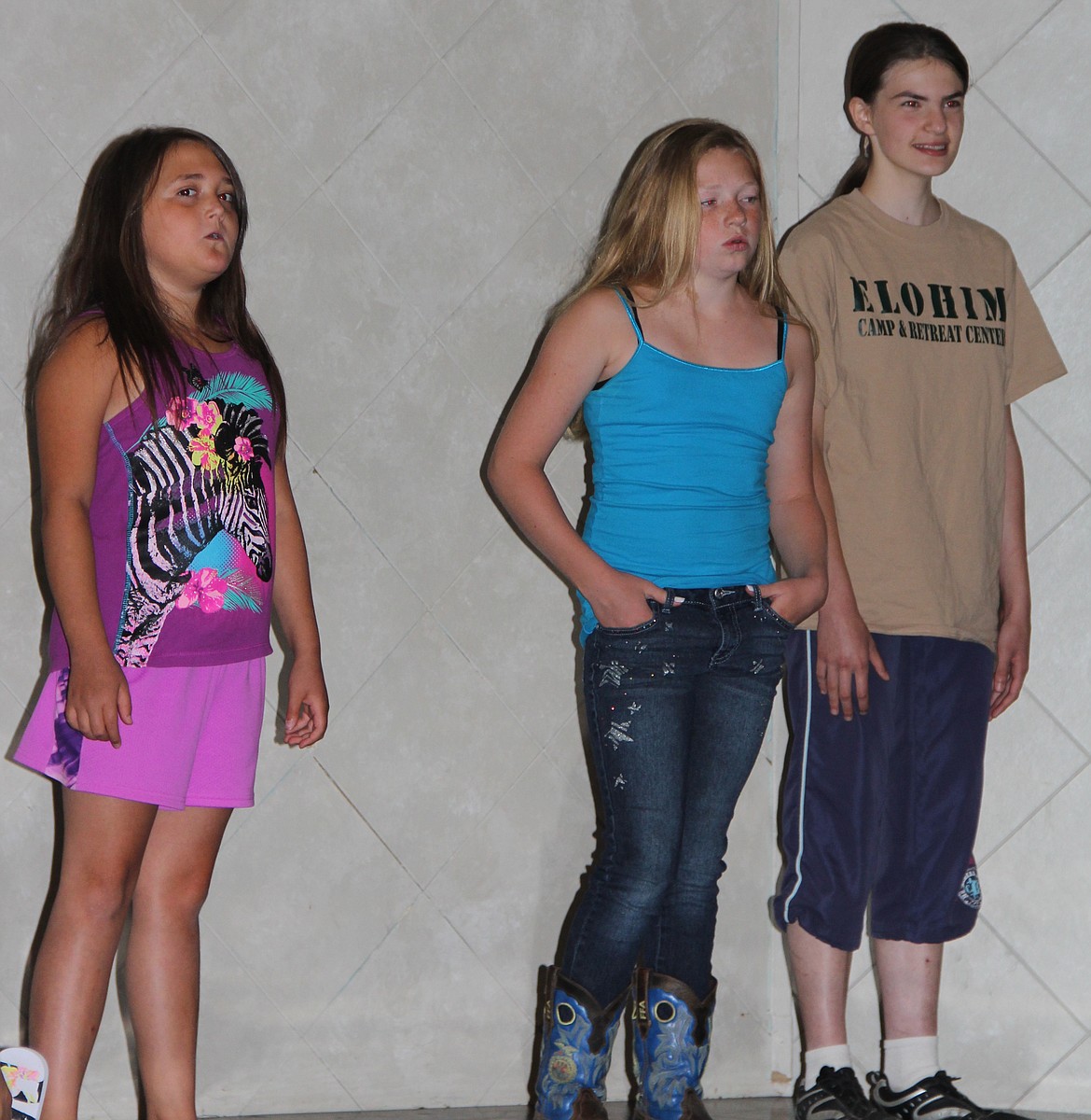 -- Photo by LYNNE HALEY

Participants at the Pearl Theater's Youth Choir Camp this week develop their singing skills: Kynsie Hinrichs, Shaylynn Richards, and Johanna Snyder, left to right.