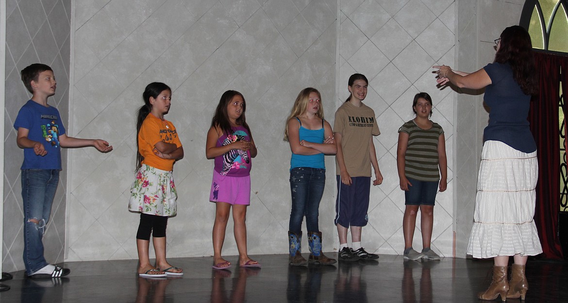 -- Photo by LYNNE HALEY

Youth choir campers take the stage at the Pearl Theater during the first day of camp: Michael Daniel, Adlee Mae Robles, Kynsie Hinrichs, Shaylynn Richards, Johanna Snyder and Meanie Klaus, left to right; instructor Autumn Mackert is in the foreground.