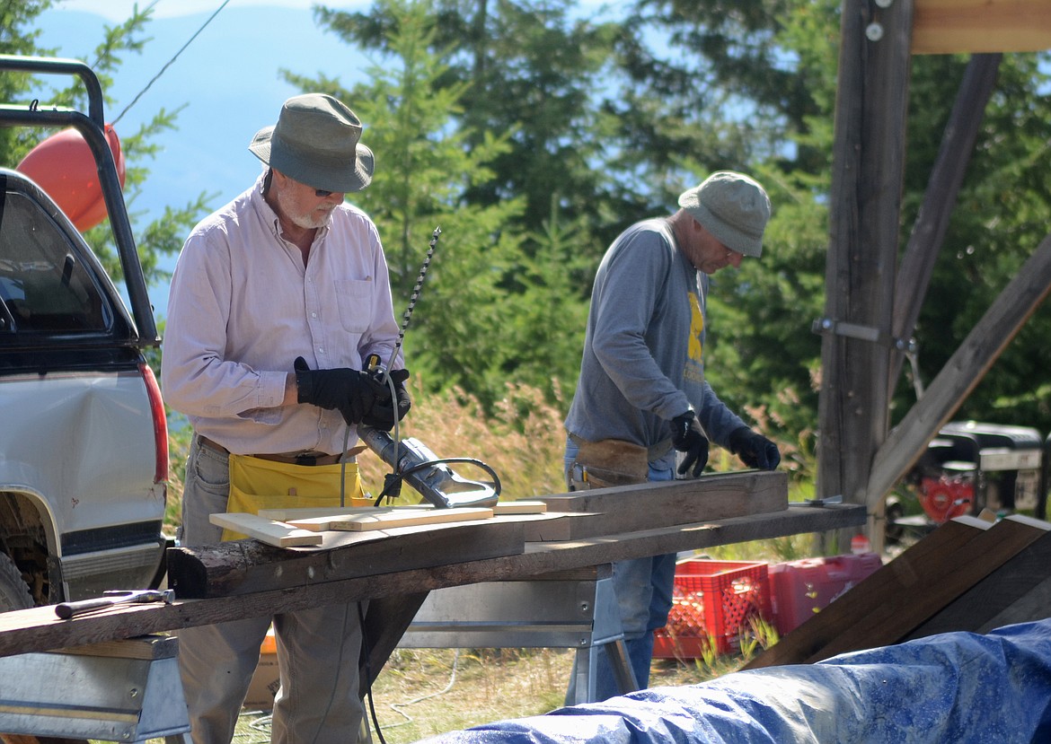 Doug Berglund and Chuck Manning measure and cut boards for the Little Napa lookout.