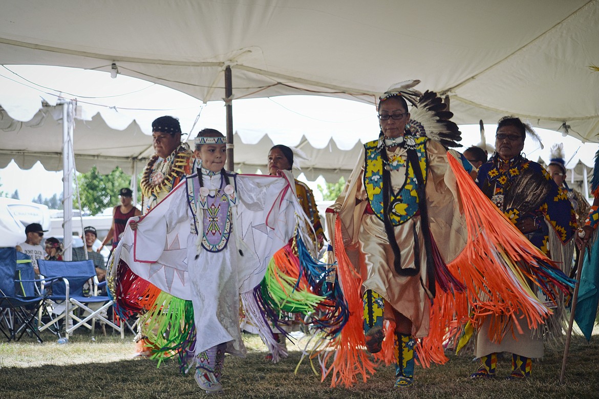 &#151; Photo by SARAH JENKINS
Elaborate regalia, some passed through the generations, add to the magic of traditional dance performances.