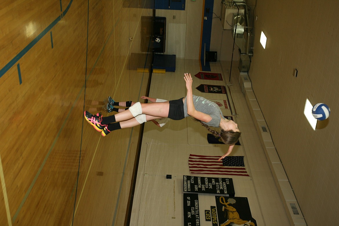 &#151;Photo by ERIC PLUMMER
Wampus Cat senior middle blocker Sarah Holderman swings away during practice this week at Clark Fork High School. The Cats, led by head coach Cindy Derr, boast a senior-laden team with some talented underclassmen, and are poised to make some noise in the North Star League this season.

&#151;Photo by ERIC PLUMMER
Football teams around the country do some variation of work on the agility bags, as the Clark Fork football team prepares for its season home opener against Timberline in a rare Saturday afternoon kickoff on Aug. 27 in Clark Fork. The Wampus Cats have 22 players out this fall, the biggest number in nearly a decade, and with weapons at the skill positions are primed for a strong season in the White Star League.